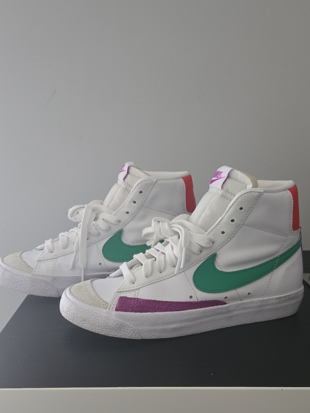 Nike White High-Top Sneakers with Green Swoosh and Pink/Purple Accents